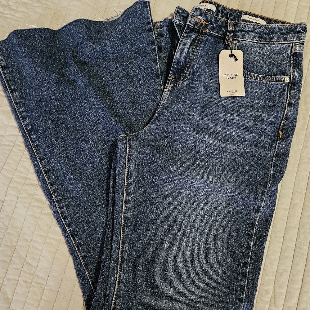 Women's size 30 Forever 21 pants, bell bottom quirky design on legs